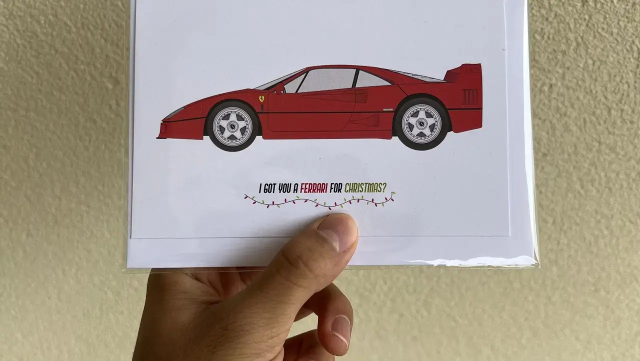 A card with a Ferrari car on it that says &lsquo;I got you a Ferrari for Christmas?&rsquo; that I bought from Artomobile at the Bowerbird market.