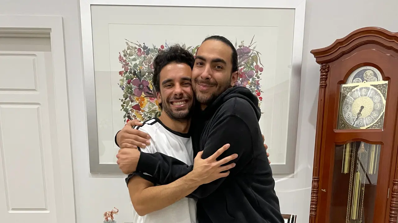 Sav and Dom Tripodi hugging each other